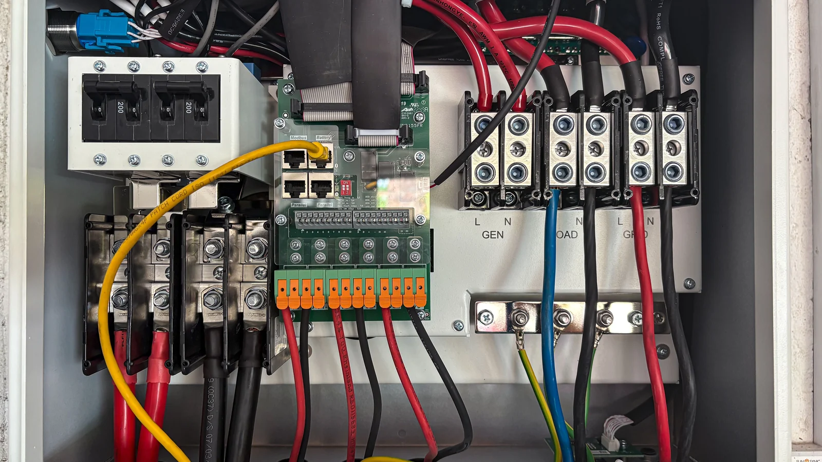 Compact PLC panel from an Omron panel builder in Saudi Arabia with an NX controller and S8VK supply